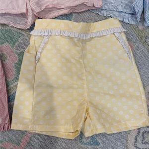 Beautiful, yellow/white Bella Bliss shorts. New without tags. Pockets. Size 10.